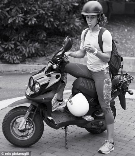 2D5E732E00000578-3270660-Just_checking_A_moped_rider_stops_to_look_at_her_phone-a-68_1444741347187-434x500