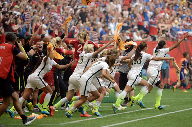 Team USA's bench reacts to the final whistle.