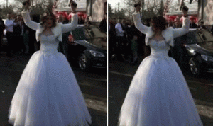 بالفيديو.. عروس تطلق النار من مسدسين في حفل زفافها