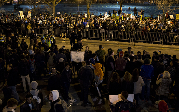 Demonstrators stand outside a canceled campaign event with Donald Trump, president and chief executive of Trump Organization Inc. and 2016 Republican presidential candidate, in Chicago, Illinois, U.S., on Friday, March 11, 2016. Trump canceled a Friday evening rally in Chicago after his campaign met with law enforcement and concluded it wasn't safe to proceed amid extensive protests in the heavily Democratic city. Photographer: Daniel Acker/Bloomberg