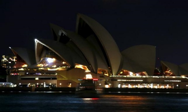 The Sydney Opera House can be seen after its lights were switched off for Earth Hour in Sydney, Australia