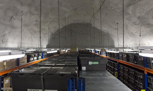 Plastic boxes on shelves hold seeds from the Icarda in Syria at the international gene bank Svalbard Global Seed Vault (SGSV) near Longyearbyen on Spitsbergen, Norway, October 20, 2015. The empty space are the missing boxes sent back when Syria requested the first-ever withdrawal of seeds from the Svalbard's Global Seed Vault earlier this year. Two consignments of crop seeds will be deposited next year in a "doomsday vault" built in an Arctic mountainside to safeguard global supplies. The vault, which opened on the Svalbard archipelago in 2008, is designed to protect crop seeds, such as beans, rice and wheat against the worst cataclysms of nuclear war or disease.  REUTERS/Anna Filipova FOR EDITORIAL USE ONLY. NO RESALES. NO ARCHIVE.