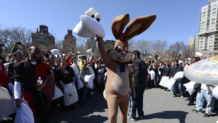 A person in a rabbit costume takes part in the world's 6th annual Pillow Fight Day in Washington Square Park in New York on April 6, 2013. The massive pillow fight, which is the New York City's 8th annual, takes place in cities around the world. AFP PHOTO/TIMOTHY A. CLARY (Photo credit should read TIMOTHY A. CLARY/AFP/Getty Images)