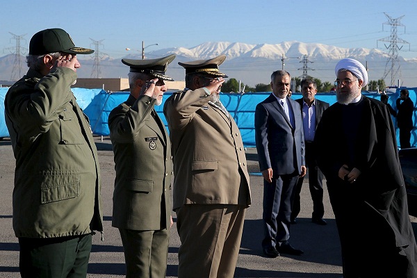 Iranian President Hassan Rouhani (R) arrives to attend a military parade marking National Army Day in Tehran, Iran, April 17, 2016. REUTERS/President.ir/Handout via Reuters ATTENTION EDITORS - THIS IMAGE WAS PROVIDED BY A THIRD PARTY. REUTERS IS UNABLE TO INDEPENDENTLY VERIFY THE AUTHENTICITY, CONTENT, LOCATION OR DATE OF THIS IMAGE. IT IS DISTRIBUTED EXACTLY AS RECEIVED BY REUTERS, AS A SERVICE TO CLIENTS. FOR EDITORIAL USE ONLY. NOT FOR SALE FOR MARKETING OR ADVERTISING CAMPAIGNS. NO RESALES. NO ARCHIVE.