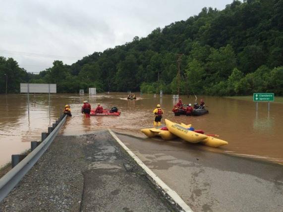 Emergency crews take out boats on a flooded I-79 at the Clendenin Exit, after the state was pummeled by up to 10 inches of rain on Thursday, causing rivers and streams to overflow into neighboring communities, in Kanawha County, West Virginia, June 24, 2016.  West Virginia Department of Transportation/Handout via Reuters