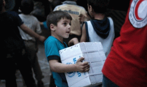 وصول قافلة مساعدات إلى الوعر المحاصرة بحمص