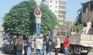 بلدية طرابلس تستعد لحملة إزالة اللافتات وصور السياسيين