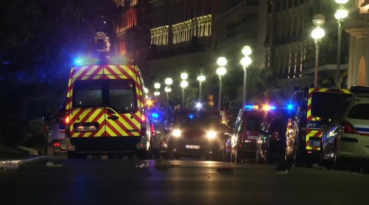 In this video grab taken Thursday July 14, 2016, ambulances and Police cars are seen after a truck drove on to the sidewalk and plowed through a crowd of revelers who’d gathered to watch the fireworks in the French resort city of Nice. Officials and eyewitnesses described as a deliberate attack. There appeared to be many casualties. (BFMTV via AP)