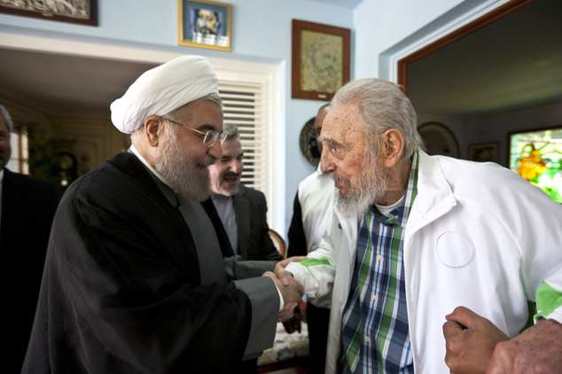 Cuba's former leader Fidel Castro, right, shakes hands with Iranian President Hassan Rouhani in Havana, Cuba, Monday, Sept 19, 2016. Rouhani is on a one-day official visit to Cuba. (AP Photo/Alex Castro)