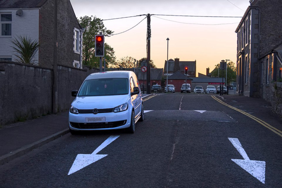 Allan Wright's picture of the pointless lights pointing the wrong down a one-way street DRIVERS have been left baffled by a set of traffic lights that face the wrong way - in a one-way street. The lights can only be seen once motorists have passed them and glance in their rear view mirror. But locals claim the presence of the lights actually lead drivers to go the wrong up the street and then wait at the lights. The mix-up was caused in Castle Douglas, Dumfries and Galloway, when a one-way street was created but the old lights left in place and switched on. Amazingly, the lights in Jenny's Loaning have been causing confusion for the past two years without the "lazy" local council taking any action. Local photographer Allan Wright revealed the traffic light teaser on social media this week, posting a picture entitled: The curious conundrum of Jenny's Loaning, Castle Douglas.