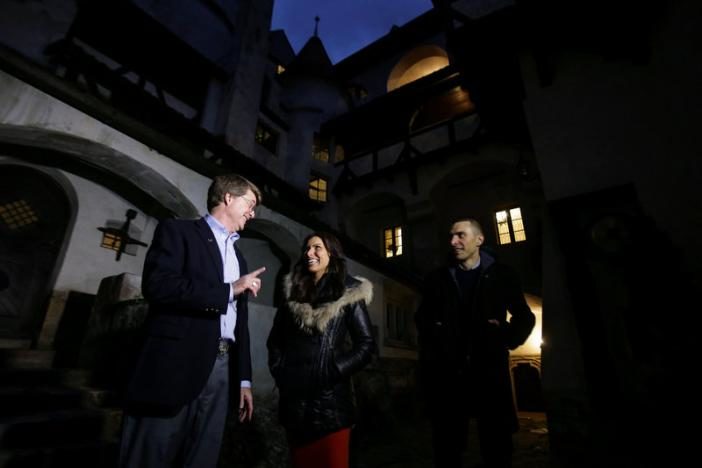 Tami and Robin Varma are greeted by Dacre Stoker, great-grand nephew of Dracula Gothic novel writer Bram Stoker, inside the courtyard of Bran Castle, in Brasov county, Romania, October 31, 2016. Inquam Photos/Octav Ganea/via REUTERS