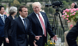 ماكرون اراد تجنيب ترامب العزلة بدعوته لاحتفالات فرنسا