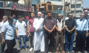 مسيرة في مخيم البداوي احتجاجًا على قرار “العمل”