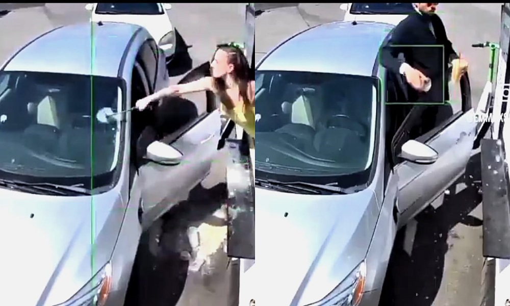 قذفها بالقهوة… فحطّمت سيارته بمطرقة! (فيديو)