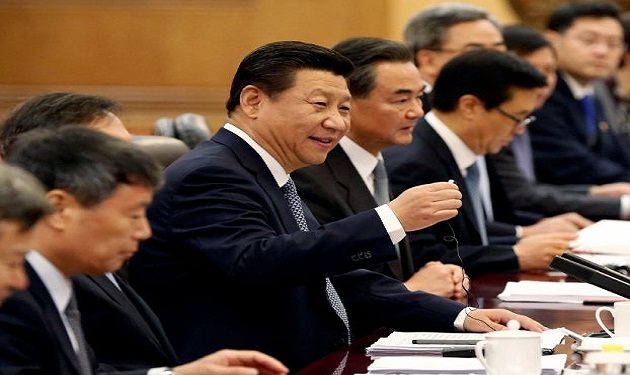 Chinese President Xi Jinping talks with Tanzania's President Jakaya Kikwete in Beijing